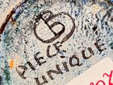 a picture of a piece of cake with a name written on it