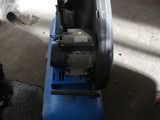 a blue machine that is sitting in the garage