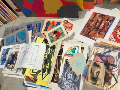 a table that has a lot of art on it