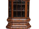 an old wooden china cabinet with glass doors and drawers