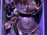a purple box filled with silverware and silver spoons