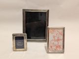 two silver picture frames with a picture of a horse and a picture of a horse