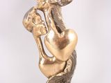 statue of a woman holding a fan on a marble base