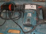 an electric drill in a case with a number 2 on it