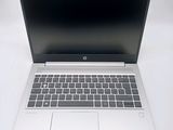 an open laptop computer sitting on top of a white table
