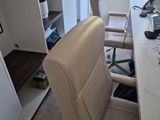 a desk with a chair and a computer on it