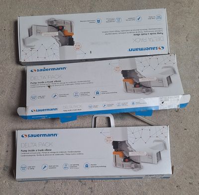 three boxes of vacuum cleaners sitting on the floor next to each other