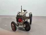 a model of a small tractor on a table