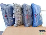 a box with a bunch of bags on top of it