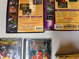 three dvds and a box of games on a table