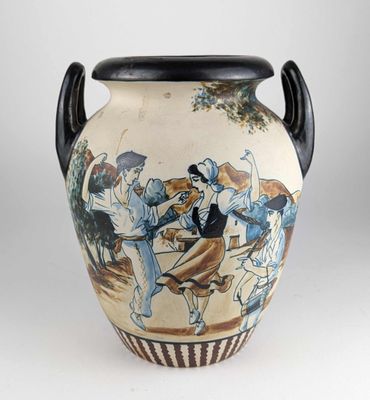 a vase with a painting on it sitting on a table