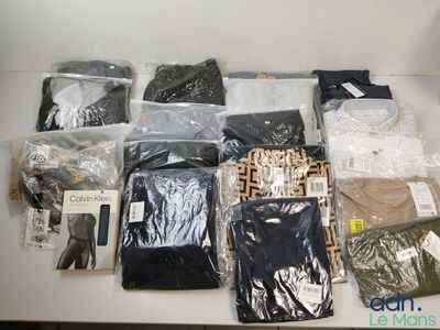 a lot of clothes that are sitting on a table