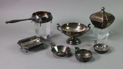 a lot of silver items that are on a table