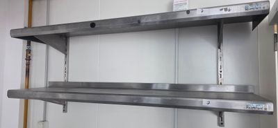 a metal shelf that has two shelves on it