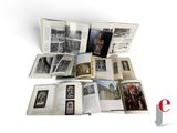 an open book on a white surface with pictures of people on it