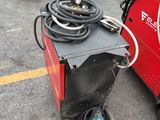 a lot of welding equipment on the ground in the parking lot