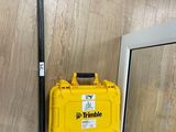 a yellow tool box sitting on the floor next to a window