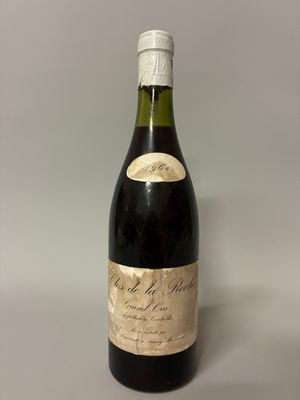 an image of a bottle of wine sitting on top of a table