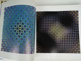 a book opened to show a picture of a person in the background