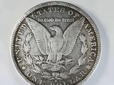 a close up of a silver coin with an eagle on it