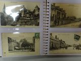 an old photo of a book with pictures of a town on it