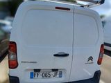 a white van that is parked on the side of the road