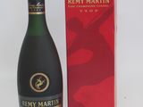 a bottle of wine that is next to a box