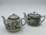 pair of chinese porcelain teapots with hand painted scenes