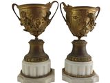 pair of antique vases on marble bases with gold decoration