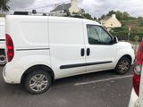 a white van that is parked in a parking lot