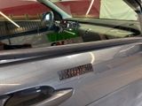 a close up of a car door handle with a sticker on it