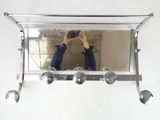 a man taking a picture of himself in the mirror