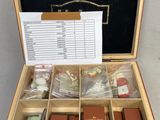 a wooden box with a lot of items inside of it