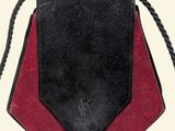 a black and red purse with a rope around it