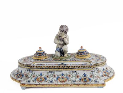 a small figurine sitting on top of a box