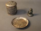 a small silver container and a small silver plate