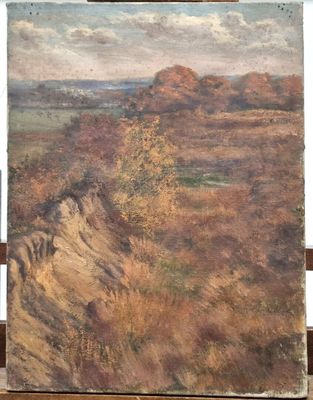 an oil painting of a landscape on a easel on a wooden table
