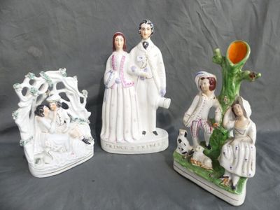 three figurines that are sitting on a table