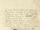 une vieille lettre écrite à l'encre noire sur un bout de papier