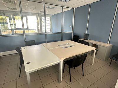an image of a conference room with a table and chairs