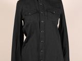 a black shirt on a mannequin mannequin stand