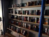 many books that are on the shelves in the room
