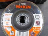 a close up of a disc on a table next to a tool bag