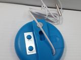 a blue object on the table with a white cord