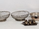 a lot of silver items sitting on a table