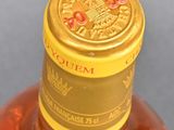 a close up of a bottle of alcohol on a table