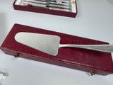 a red case with silverware in it on a table