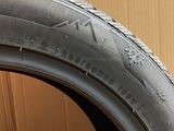 a close up of a tire with a glove on it