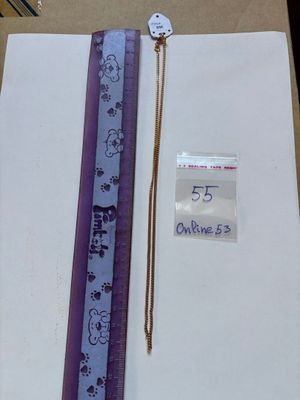 a ruler and a ruler on a table next to a piece of paper