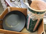 a box that has a pan and a mug in it